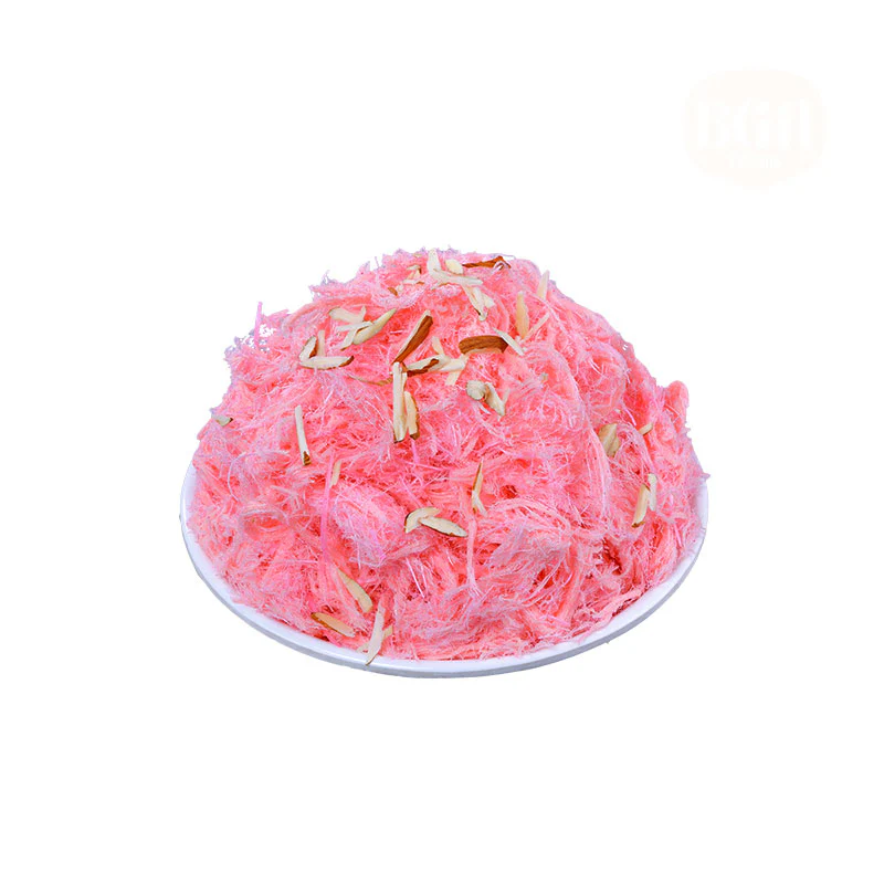 A white plate topped with a fluffy, pink Rose Soan Cake, garnished with sliced almonds, showcasing its delicate, shredded texture and vibrant color